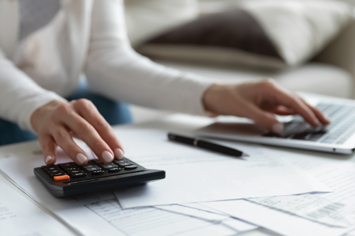 Close up of woman busy paying bills online on computer